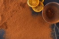 Cocoa powder in a sieve over black slate background Royalty Free Stock Photo