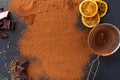 Cocoa powder in a sieve over black slate background Royalty Free Stock Photo