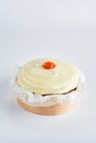 Sweet baked mini carrot cake with cream cheese frosting on recycle Mini Wooden Baking Mold, white background, copy space,