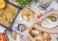 Sweet, baked pumpkin and pie with pear. Autumn dinner for the whole family. Children`s hands in the frame. Copy space