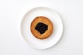 Sweet bakery at a round plate isolated at white background. Pastry image