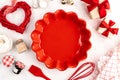 Sweet baking concept for Valentine's day, cooking background with baking - whisk for whipping, red ceramic cake pan