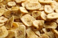 Sweet banana slices as background. Dried fruit