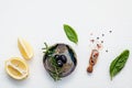 Sweet basil vinaigrette dressing ingredients on white wooden background with flat lay Fresh sweet basil leaves, lemon, olive oil