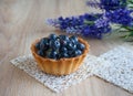 Sweet basket with cream and bilberry