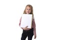 Sweet beautiful female child 6 to 8 years old holding notebook