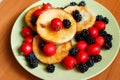 Sweet berry omelet with blackberry and hawthorn