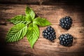 Sweet blackberries leaves on vintage wooden board