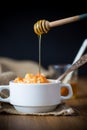 Sweet boiled pumpkin porridge with rice in a plate on a wooden Royalty Free Stock Photo