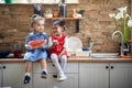 Sweet Bonds: Two Young Girls Creating Memories with Muffins and Watermelon in the Kitchen