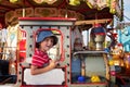 Sweet boy, riding in a train on a merry-go-round, carousel attra