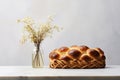 Sweet braided traditional bread in light kitchen interior with home decoration