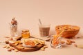 Sweet breakfast with cappuccino in a glass. Beige and orange monochrome color scheme