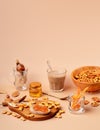 Sweet breakfast with cappuccino in a glass. Beige and orange monochrome color scheme still life with copy space