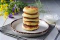 Sweet breakfast: cottage cheese pancakes with ricotta stacked on a nice plate.