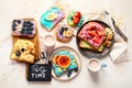 Sweet breakfast with cup of cocoa. Toast with cream cheese, banana, strawberries, blueberries