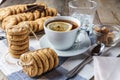 Chip cookies, a cup of tea with lemon, sugar, glass of ice wate Royalty Free Stock Photo