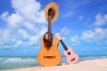 Sweet brown guitar and pink ukulele,hat, headphones,football.