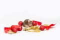 Sweet brown mouse sitting among red and gold Christmas decorations. Royalty Free Stock Photo