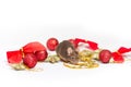 Sweet brown mouse sitting among red and gold Christmas decorations. Royalty Free Stock Photo