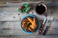 Sweet bun and cup of black coffee on vintage wooden table Royalty Free Stock Photo