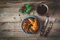 Sweet bun and cup of black coffee on vintage wooden table Royalty Free Stock Photo