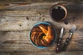 Sweet bun and cup of black coffee on vintage wooden table Royalty Free Stock Photo