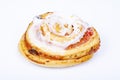 Sweet bun with raisins and white sugar icing. Studio Photo. Royalty Free Stock Photo