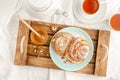 Sweet buns, grated coconut and honey on a wooden tray. Breakfast concept. Top view, flat lay Royalty Free Stock Photo