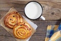 Sweet buns and mug of milk Royalty Free Stock Photo