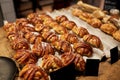 Sweet buns with price tags at bakery store