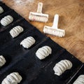 Sweet buns from raw dough on a baking sheet, background Royalty Free Stock Photo