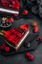 Sweet cake with fresh berries and jelly on old wooden board Royalty Free Stock Photo