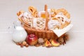 Sweet cakes in basket, fruit and milk decoration