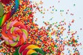 Sweet candies and lollipops, colorful sugar balls on white background