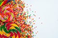 Sweet candies and lollipops, colorful sugar balls on white background