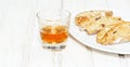 Sweet cantuccini biscuits and wine. Homemade Italian biscotti cookies on woden table Royalty Free Stock Photo