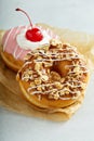 Sweet caramel and cherry glazed donuts