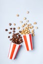 Sweet caramel chocolate popcorn in paper striped white red cup Royalty Free Stock Photo