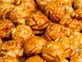 sweet Caramel Cream popcorn on the black background