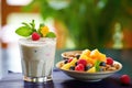 sweet cashew dressing with fruit salad, mint leaf garnish