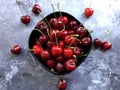 Sweet cherries in a bowl over concrete background. Royalty Free Stock Photo