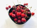 Sweet cherries in a bowl over marble background. Royalty Free Stock Photo