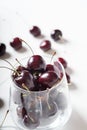 Sweet cherries in cherry glass bowl around white. close up Royalty Free Stock Photo