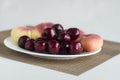 Sweet cherries and donut peaches Royalty Free Stock Photo