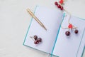 Sweet cherries,red heart and note book with golden pen.Openning note book white blank page with pen and lovely red Royalty Free Stock Photo