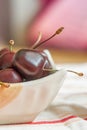 Sweet cherries in white ceramic cup Royalty Free Stock Photo