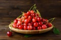 Sweet cherries in a wooden plate Royalty Free Stock Photo
