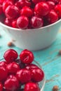Sweet Cherry in Bowl on Rustic Table Royalty Free Stock Photo
