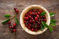 Sweet cherry with leaves in wooden bowl. Fresh ripe cherries. Cherry fruit Royalty Free Stock Photo